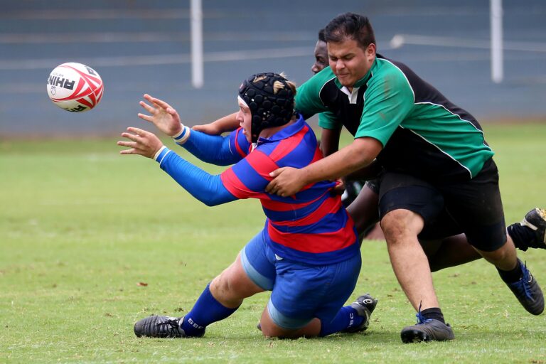 Rugy players mid-tackle